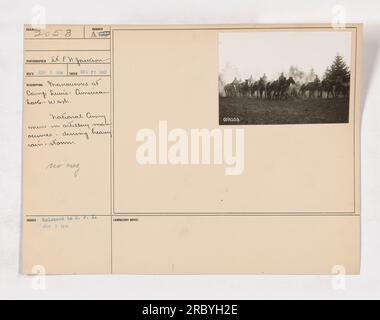 National Army men participating in artillery maneuvers during a heavy rainstorm at Camp Lewis, American Lake, Washington. Photograph taken by SK. E. V. Jackson on December 27, 1917. The image showcases the dedication and perseverance of the soldiers despite adverse weather conditions. Stock Photo