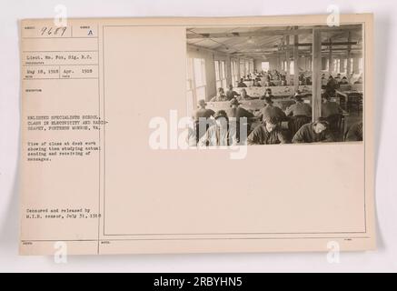 Enlisted specialists at Fortress Monroe, Virginia are seen studying electricity and radiography in May 1918. The class is focused on the practical application of sending and receiving messages. The photograph is part of the collection taken during World War I, and it was censored and released by the M.I.B. censor on July 31, 1918. Stock Photo