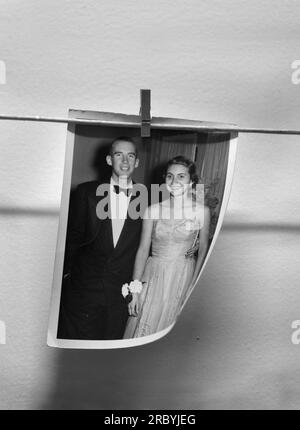 A 1950s prom portrait of a formally-dressed young American couple for sale in an antique shop. Stock Photo
