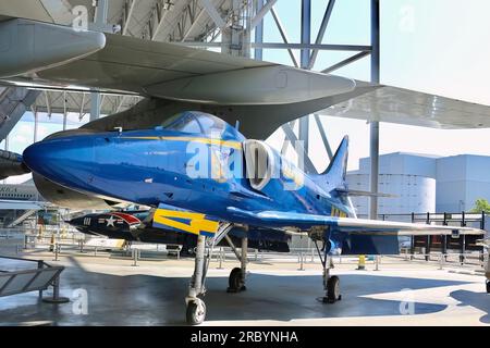 Douglas A-4F Skyhawk II light attack aircraft in Blue angels livery under the wing of the first Jumbo jet Boeing 747 Seattle Washington State USA Stock Photo