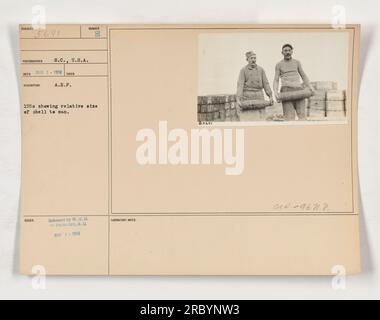 Soldiers standing beside a large artillery shell, demonstrating its size in comparison to a person. Image was taken in March 1918, and the photograph was released by the War Office to the Photo Division. Lab notes mention the laboratory action and act number of the image. Stock Photo