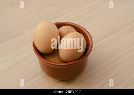 Close-up of brown chicken eggs, bringing the beauty and simplicity of nature into your kitchen. Stock Photo