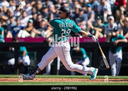 Seattle Mariners' Cal Raleigh bats during the first inning of a spring  training baseball game against the Texas Rangers, Sunday, March 19, 2023,  in Surprise, Ariz. (AP Photo/Abbie Parr Stock Photo - Alamy