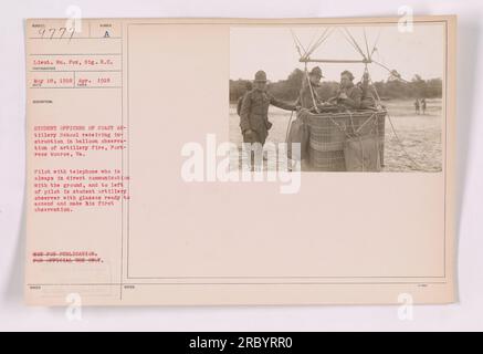Student officers of the Coast Artillery School receiving instruction in balloon observation of artillery fire at Fortress Monroe, Va. A pilot with a telephone remains in direct communication with the ground, while a student artillery observer with glasses prepares to ascend for his first observation. This image is marked as not to be published and is for official use only. Stock Photo