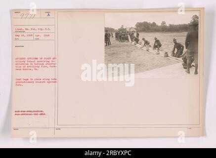 Student officers of the Coast Artillery School at Fortress Monroe, Virginia, receiving instruction in balloon observation of artillery fire. Sandbags are placed along the tube as a precautionary measure against fire. This photograph was taken on April 1918 by Lieutenant William Fox, Signal Reserve Corps. Stock Photo