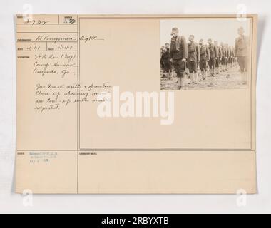 Soldiers participate in a gas mask drill and practice at Camp Hancock in Augusta, GA. In the photo, the men can be seen in a lineup, with their gas masks properly adjusted. The image was taken by LT. Kingsmore Sight on January 21, 1918 and released by W.O.D. to the Photo Division on February 4, 1918. Stock Photo