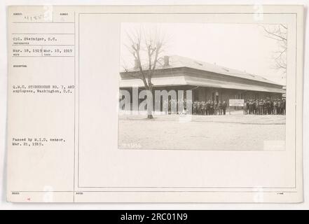 Caption: 'Cpl. Steiniger and employees of the Q.M.C. Storehouse No. 7 in Washington, D.C., March 18, 1919. The photograph was taken on March 10, 1919. It shows the staff and facility of the storehouse. The image was approved by the M.I.D. censor on March 21, 1919.' Stock Photo