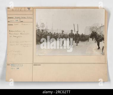 Rainbow Division soldiers from the American Expeditionary Force (A.E.F.) disembark at St. Nazaire, France in 1918. Colonel W.G. Kelly, Lieutenant Colonel Harold (last name illegible), Chaplain Ball, and Captain Elihu (last name illegible) are present. The photograph was taken by the Signal Corps, U.S.A on February 7, 1918. Stock Photo