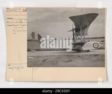 This image shows a side view of a Macchi seaplane at Langley Field, VA. The photograph was taken in December 1917 and received the same month. It is part of a collection of photographs showcasing American military activities during World War One. Stock Photo