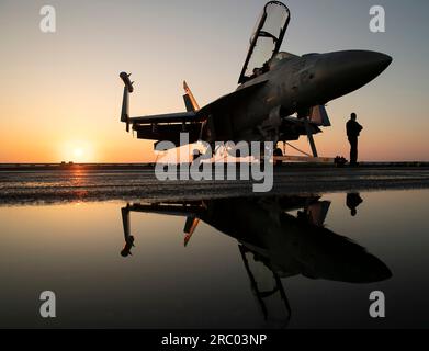 Adriatic Sea, International Waters. 09th July, 2023. Adriatic Sea, International Waters. 09 July, 2023. A U.S. Navy E/A-18G Growler fighter jet, attached to the Gray Wolves of Electronic Attack Squadron 142, on the flight deck aboard the Nimitz-class aircraft carrier USS Gerald R. Ford at sunrise operating on the Adriatic Sea, July 9, 2023 off the coast of Albania. Credit: MC2 Jackson Adkins/U.S. Navy Photo/Alamy Live News Stock Photo