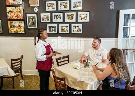 Atlanta Georgia,Mary Mac's Tea Room restaurant,inside interior indoors,tables customers dining,Black African American female woman,server waitress,hel Stock Photo