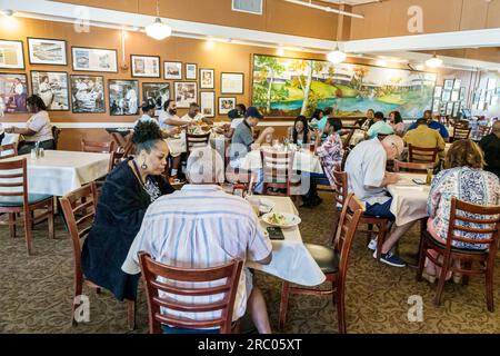 Atlanta Georgia,Mary Mac's Tea Room restaurant,inside interior indoors,tables customers dining,Black African American couple man woman,restaurants,din Stock Photo