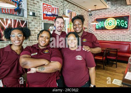 Atlanta Georgia,The Battery Atlanta Truist Park stadium,mixed use development,Goldbergs deli foods restaurant,inside interior,staff servers workers,Bl Stock Photo