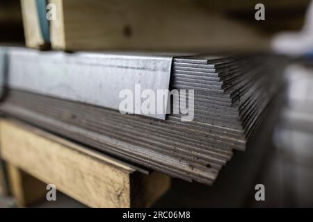 a stack of galvanized thick hot rolled steel sheets in a warehouse Stock Photo