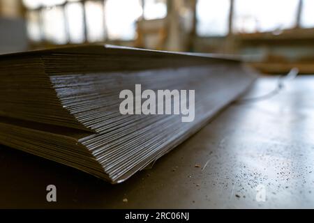 a stack of galvanized thin hot rolled steel sheets in a warehouse Stock Photo