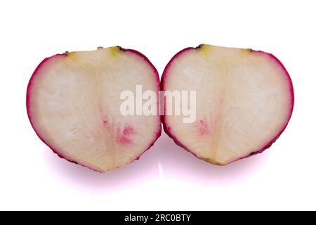 Two half radishes on a white background in close-up Stock Photo