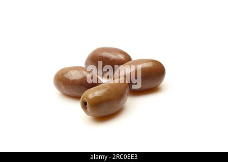 Few brown Greek Kalamata olives isolated on white background Stock Photo