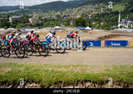 Leaders of elite women's race juast after start with a view on Krynica Zdrój during 2023 UEC MTB Elite European Championships - European Games -Cracow Stock Photo