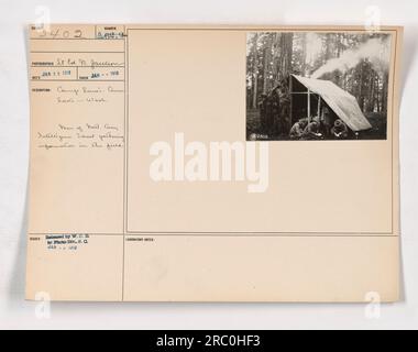 Men of the National Army Intelligence School at Camp Lewis in American Lake, Washington, can be seen in the field gathering information. The photograph was taken by St Ed. N. Jackson on January 25, 1918, and received the number A.02.2. It was released by W. C. D. to the Photo Division in January 1918. Stock Photo