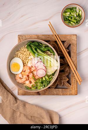 Food photography of soup ramen, boiled egg, onion, shrimp, noodle, prawn, miso, seafood, chinese, japanese, dish, bowl, chopstick Stock Photo