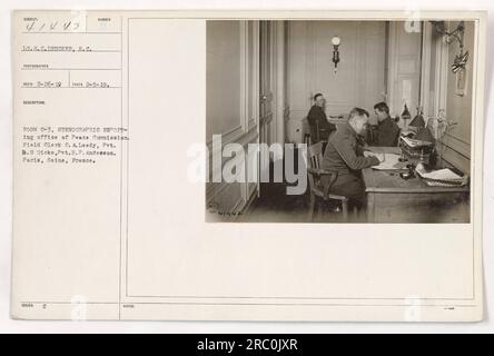 LT.H.C.DRUCKER, S.C. photographer captures 41442 during his reconnaissance mission on February 5, 1919. This image shows Room C-3 at the stenographic reporting office of the Peace Commission in Paris, France. Field Clerk C.A. Leedy, Pvt. B.S. Dicks, and Pvt. H.P. Anderson can be seen in the photograph. (Notes: 36²41442) Stock Photo