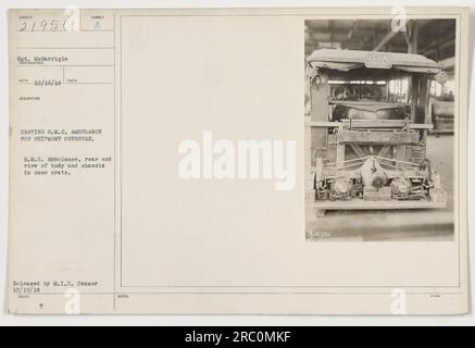 Image shows a G.M.C. Ambulance being crated for shipment overseas during World War One. The photograph, taken by Sgt. MeGarrigle, captures a rear view of the ambulance's body and chassis inside the crate. It was released by the M.I.D. Censor on 10/19/18. Notes indicate the file number is 9021356, and it originates from the USA-MD collection. Stock Photo