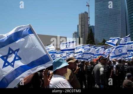 Tel Aviv, Israel. 11th July, 2023. People take part in a protest against the government's plan to overhaul the judiciary in Tel Aviv, Israel, on July 11, 2023. Tens of thousands of Israeli protesters staged rallies across the country on Tuesday, in the largest weekday protest in months against the hard-right government's plan to overhaul the judiciary. Credit: Chen Junqing/Xinhua/Alamy Live News Stock Photo