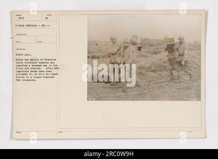 Stretcher bearers assisting in the transportation of a wounded soldier to a first aid station after the Battle of Flanders. Once treated, he will be transferred to a larger hospital for further medical care. Stock Photo