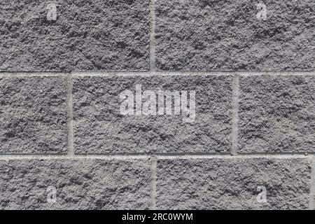 Grey brick wall exterior background texture. Taken in Toronto, Canada. Stock Photo
