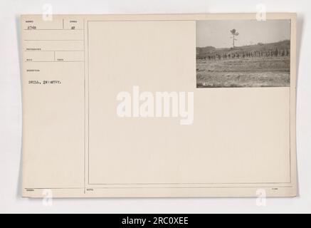 Soldiers participating in a drill exercise during World War One. They are members of the infantry, seen following orders and practicing formations. This photograph captures the seriousness and discipline of military training during the war. (Source: National Archives, Photographs of American Military Activities during World War One) Stock Photo