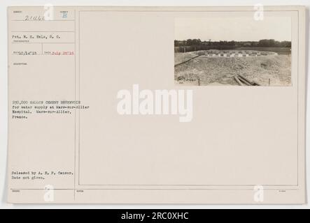 21460 Private W.H. Eels, of the Signals Corps, is pictured at the Mars-sur-Allier Hospital in France on July 25, 1918. The photograph shows a 230,000-gallon cement reservoir used for the water supply. This image was taken by an unknown photographer and was released by the A.E.P. Censor. Date of issue is unavailable. Stock Photo