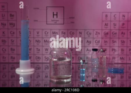 Bottles on periodic table of chemical elements. Space for text Stock ...