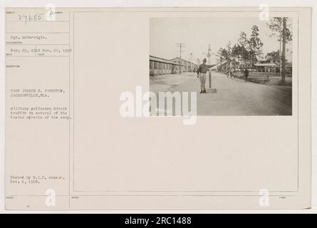 Military policemen directing traffic in the streets of Camp Joseph E. Johnston, Jacksonville, FL. This photograph was taken on Nov. 29, 1918, and approved by the M.I.D censor on Dec. 4, 1918. It is labelled as photo number 27685 in the collection. Stock Photo