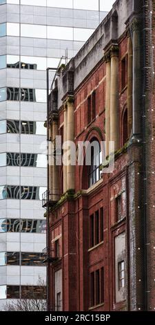 Ancient Order of United Workmen Temple building (now demolished) and modern facade, Portland, Oregon, USA. Stock Photo