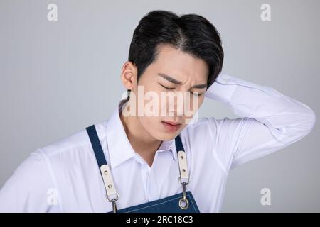 millennials and gen z, korean asian young man struggling Stock Photo