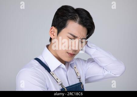 millennials and gen z, korean asian young man struggling Stock Photo