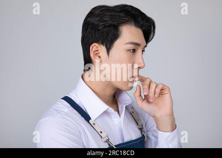 millennials and gen z, korean asian young man struggling Stock Photo