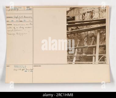 Workmen busy constructing a ship during World War One. Women can be seen working alongside the men, highlighting the influx of female labor during the war. This photo was taken in December 1917 at Camps Shipyard. It was released by the War Department to the Photo Division and is numbered A50. Photographed by Coph. a. K. Dawson. Stock Photo