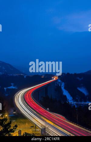 Europabruecke, Brenner motorway A13, with 190 metres height highest bridge in Austria, night photo with light traces of the cars, Schoenberg im Stock Photo