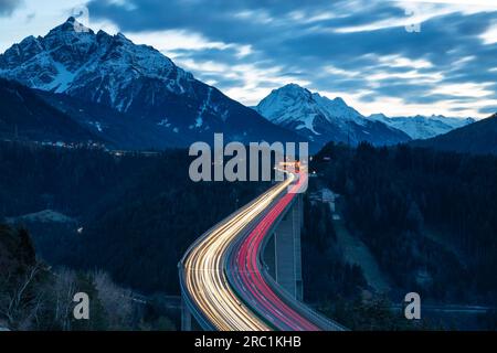 Europabruecke, Brenner motorway A13, with 190 metres height highest bridge in Austria, night photo with light traces of the cars, Schoenberg im Stock Photo