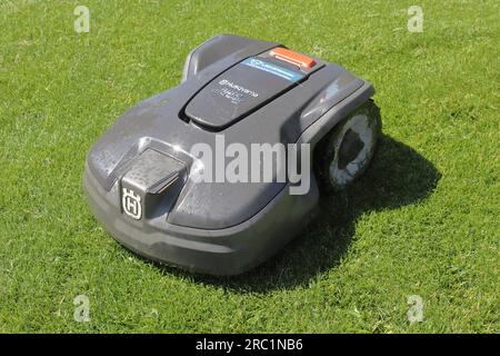 Lidingo, Sweden - July 11, 2023: One Husqvarna  Automower 305 robotic lawn mover. Stock Photo
