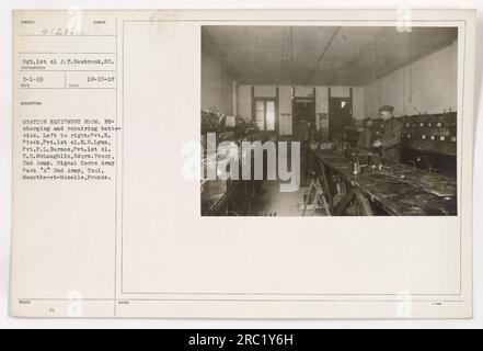 Sergeant 1st class J.T. Seabrook of South Carolina is seen in this image taken on March 1, 1919. The photo depicts soldiers in the equipment room recharging and repairing batteries. From left to right: Private H. Pisek, Private 1st class E. H. Lynn, Private F.L. Barnes, and Private 1st class T.O. McLaughlin of Headquarters Troop, 2nd Army Signal Corps. This picture was taken at Army Park 'A' in 2nd Army, Toul, Meurthe-et-Moselle, France on December 10, 1918. Stock Photo