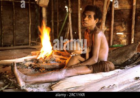 Woman and child of the Korowai people, West Papua, West New Guinea, Irian-Jaya, Tree People, Indonesia Stock Photo