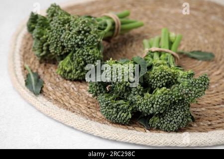 Fresh raw broccolini on white table, closeup. Healthy food Stock Photo