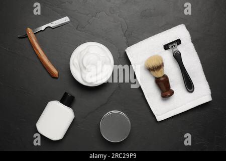 Set of men's shaving tools on black textured table, flat lay Stock Photo