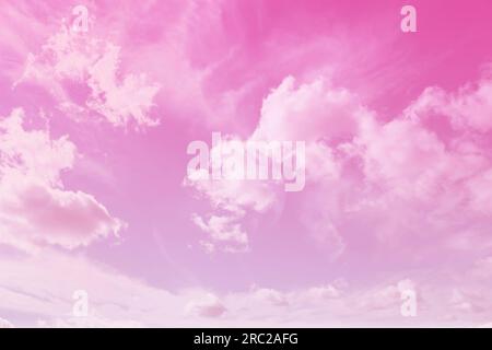Fluffy clouds floating in beautiful pink sky Stock Photo