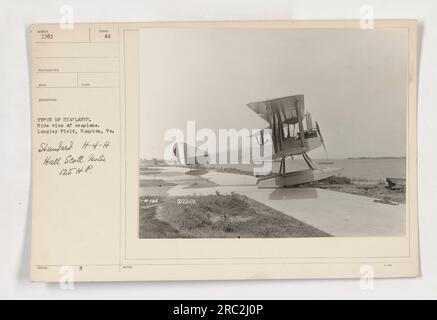 Side view of a seaplane at Langley Field in Hampton, Va. The seaplane is a Standard H-4-H Hall Scott model with a 125 HP Humber engine. The photograph was taken to showcase the different types of seaplanes used during World War One. Issued by Syndol, the photographer noted it as #186 and labeled it as 336B. Stock Photo