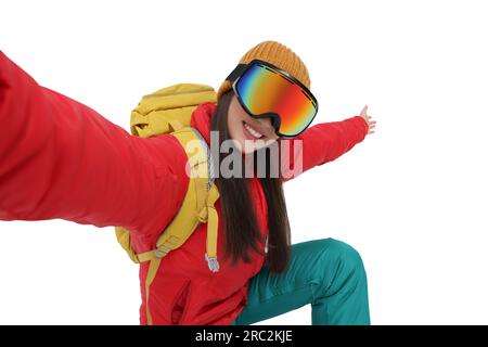 Smiling woman wearing ski goggles Stock Photo - Alamy