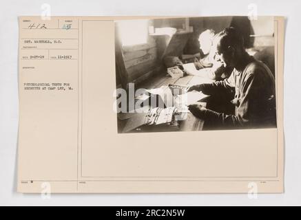 Psychological test conducted for recruits at Camp Lee, VA. The photo shows Sergeant Marshall administering the test. This image provides visual documentation of the psychological testing process used to assess and screen recruits during World War One. Stock Photo