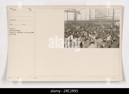 A group of shipbuilding workers attending a patriotic meeting during World War One. The workers are gathered together, potentially discussing their commitment to the war effort. This photograph documents their dedication and support for their country's military activities. Stock Photo